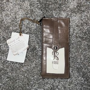 HOBO wallet with zipper NWT original price $64. Color is “Ash” brown.